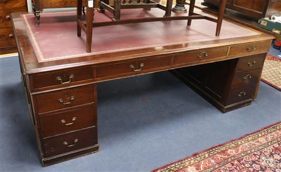 A large reproduction mahogany partners desk W.221cm